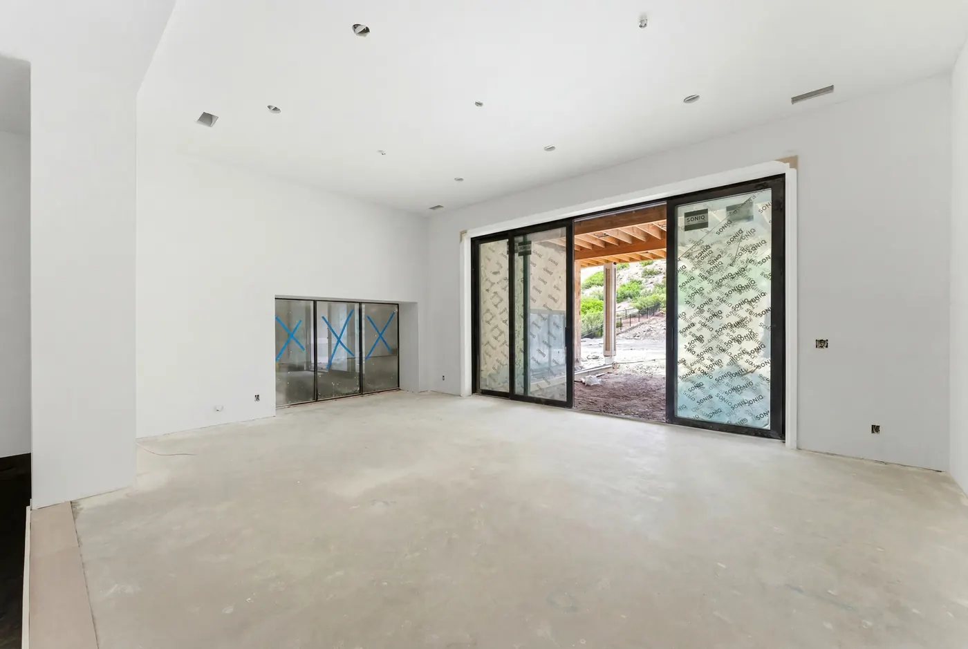 Walkout lower level with glass doors to the courtyard